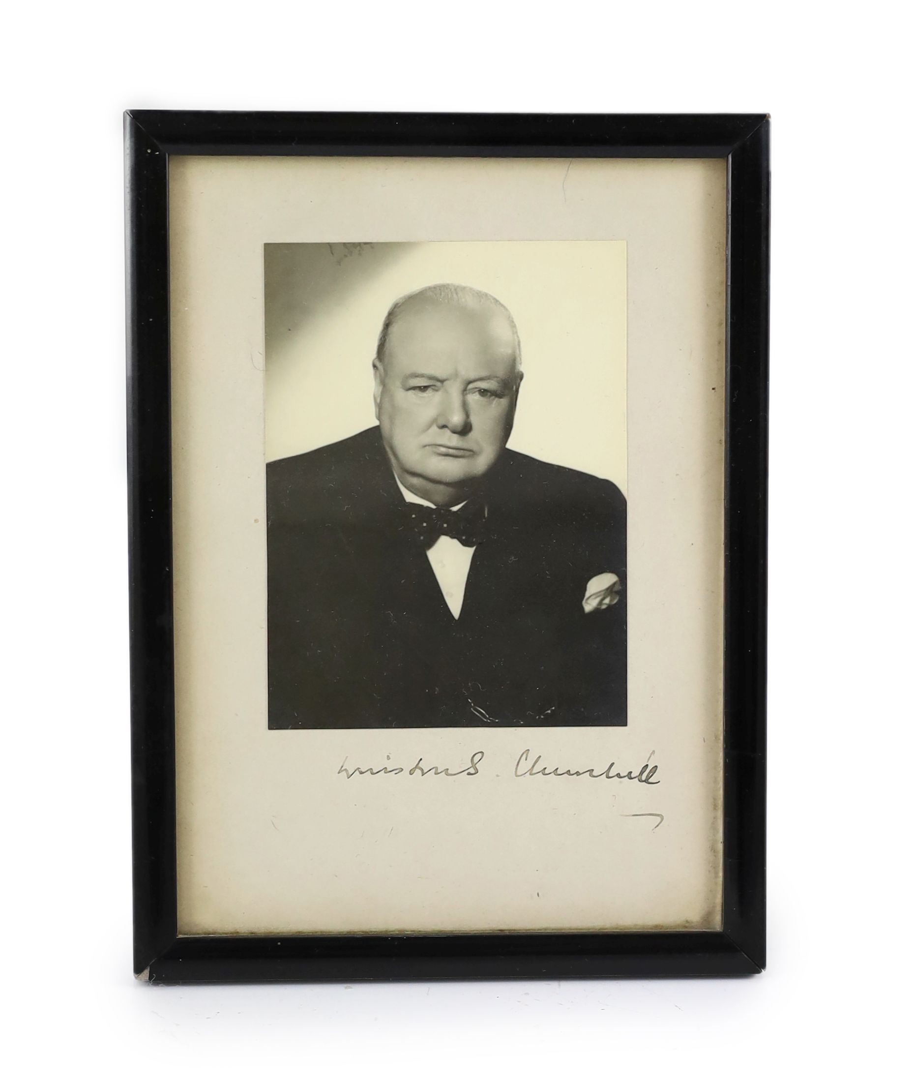 A signed black and white photograph of Winston Churchill by Vivienne, overall 19 x 14cm